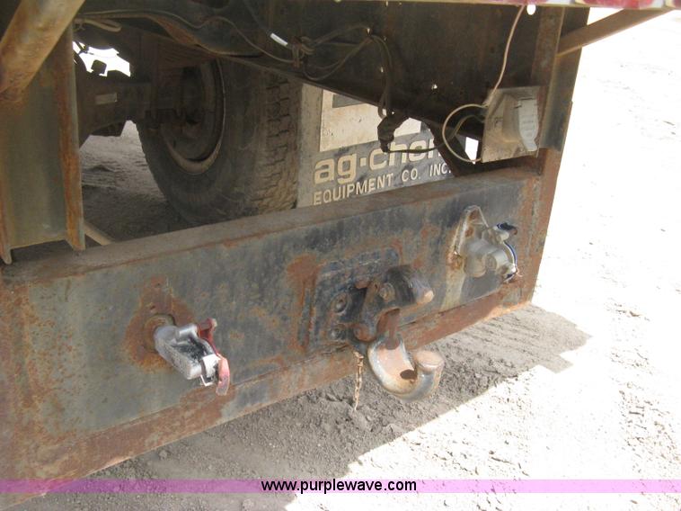 image for item D8299 1982 International 1954 flatbed tender truck