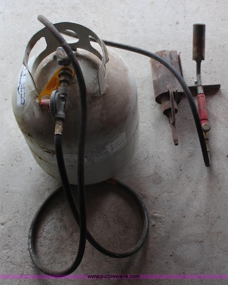 Propane tank with weed burner regulator and wand in Kirwin, KS Item X9441 sold Purple Wave