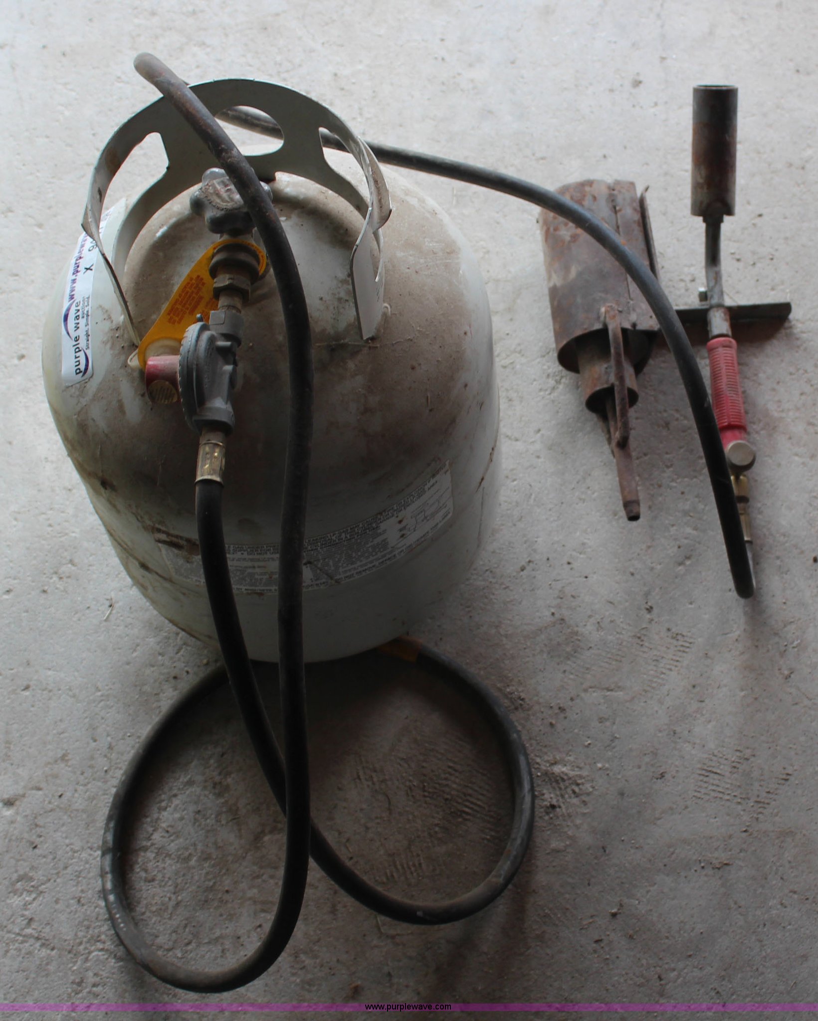 Propane tank with weed burner regulator and wand in Kirwin, KS Item X9441 sold Purple Wave