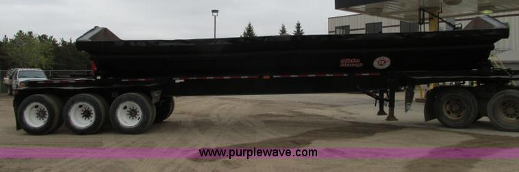 image for item E5134 1999 Circle R SS443 tri axle side dump trailer