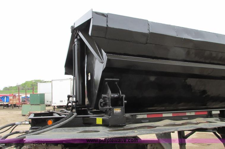 image for item E5134 1999 Circle R SS443 tri axle side dump trailer