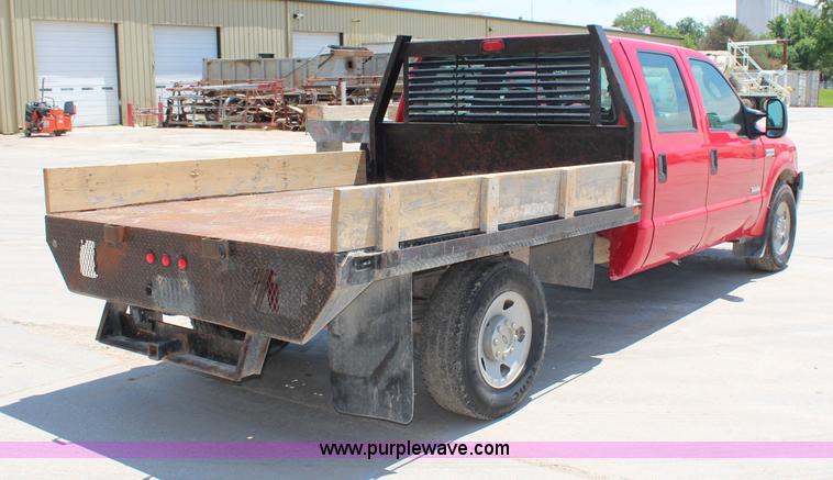 image for item G5250 2006 Ford F350 XL Super Duty Crew Cab flatbed pickup truck