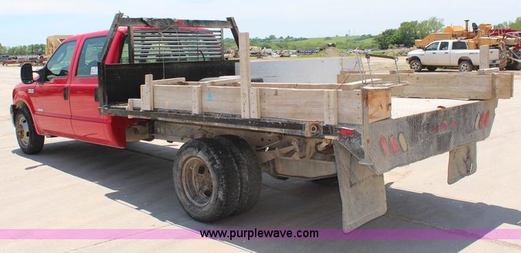 image for item G5471 2006 Ford F350 XL Super Duty Crew Cab flatbed pickup truck