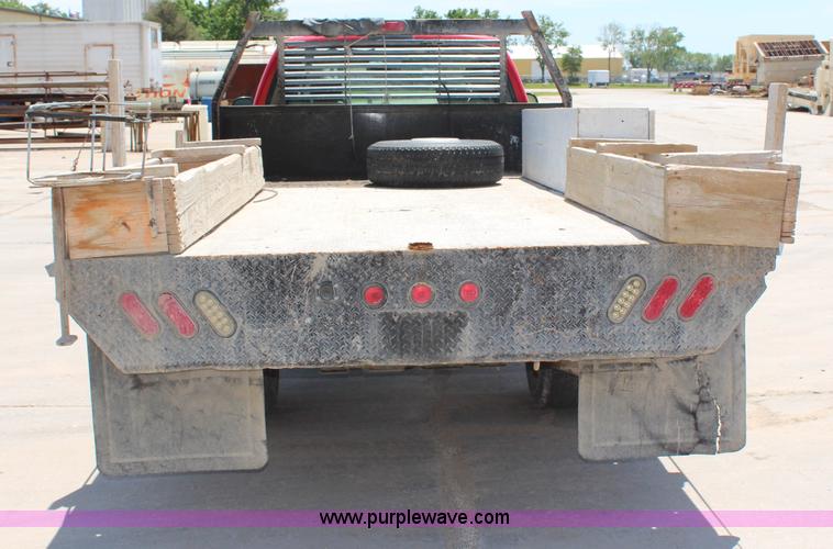 image for item G5471 2006 Ford F350 XL Super Duty Crew Cab flatbed pickup truck