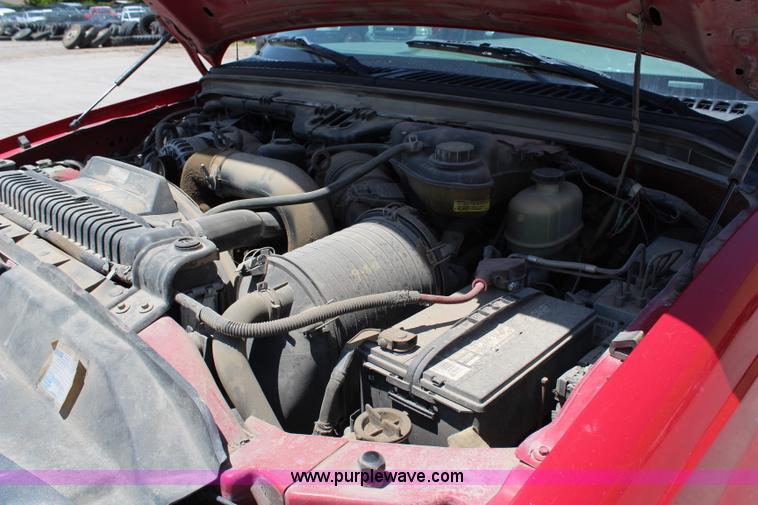 image for item G5471 2006 Ford F350 XL Super Duty Crew Cab flatbed pickup truck