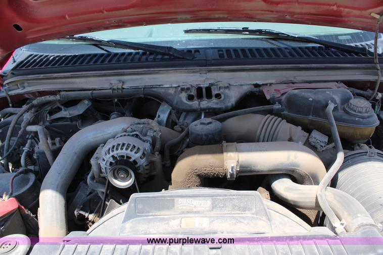 image for item G5471 2006 Ford F350 XL Super Duty Crew Cab flatbed pickup truck