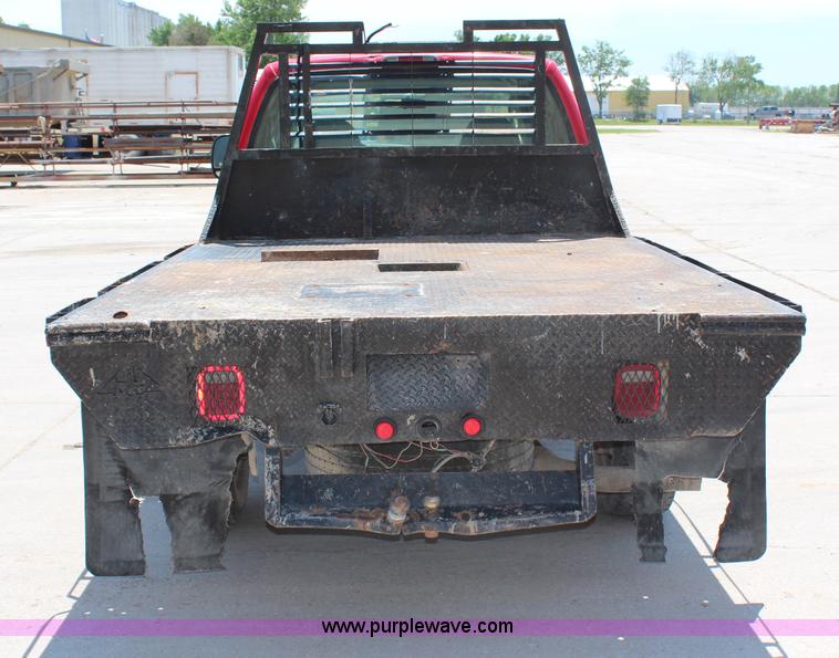 image for item G5496 2005 Ford F350 XL Super Duty Crew Cab flatbed pickup truck