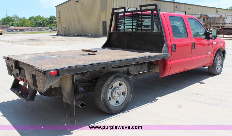 image for item G5496 2005 Ford F350 XL Super Duty Crew Cab flatbed pickup truck