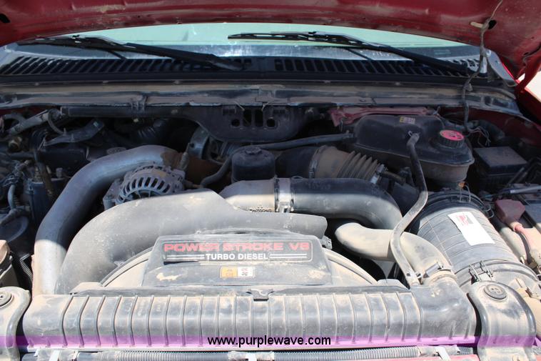 image for item G5496 2005 Ford F350 XL Super Duty Crew Cab flatbed pickup truck