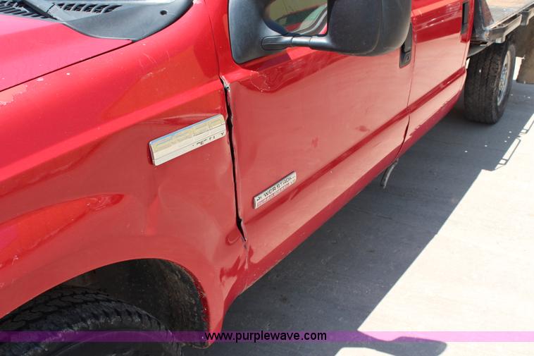 image for item G5496 2005 Ford F350 XL Super Duty Crew Cab flatbed pickup truck