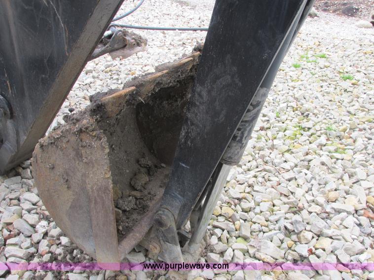 image for item AB9369 Ford New Holland B124 skid steer backhoe attachment