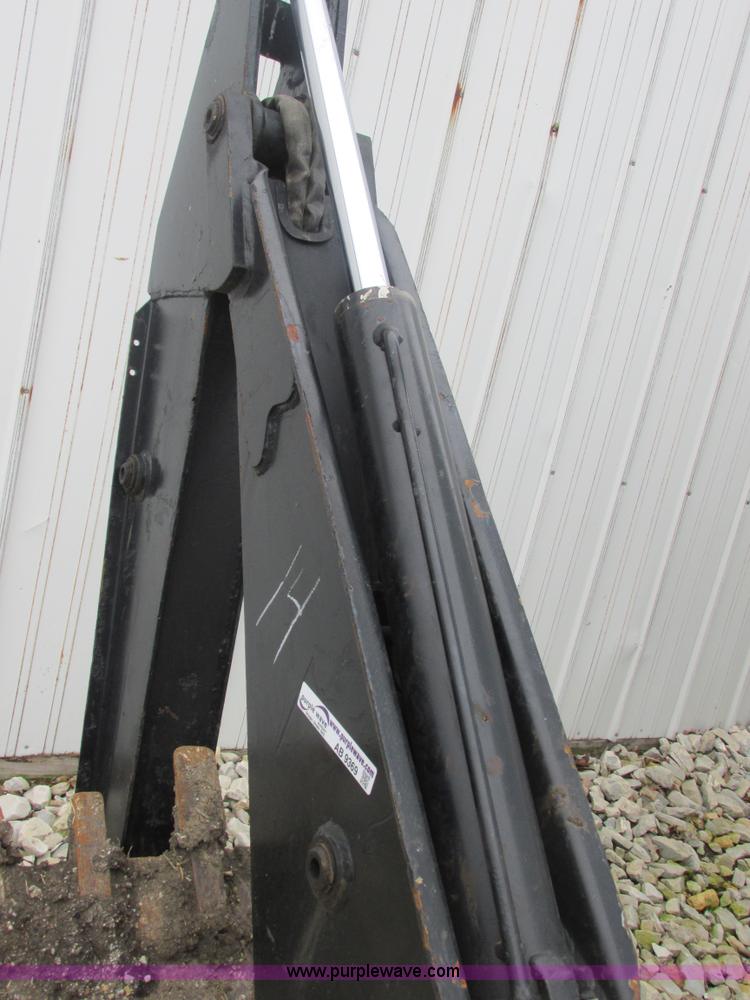 image for item AB9369 Ford New Holland B124 skid steer backhoe attachment