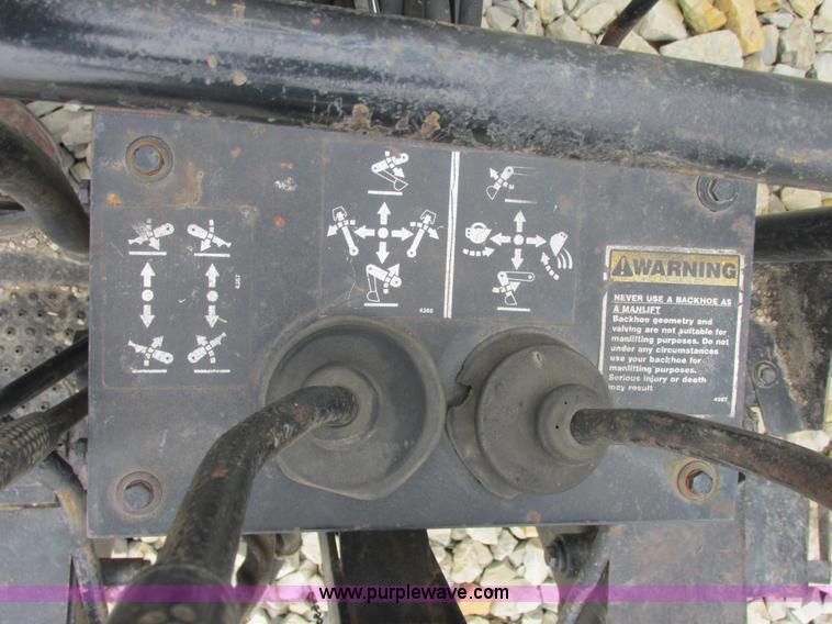 image for item AB9369 Ford New Holland B124 skid steer backhoe attachment