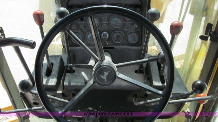 image for item E3992 1992 John Deere 670A articulated motor grader