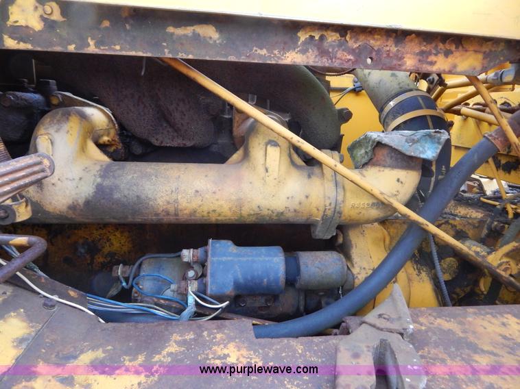 image for item G3235 John Deere elevating scraper