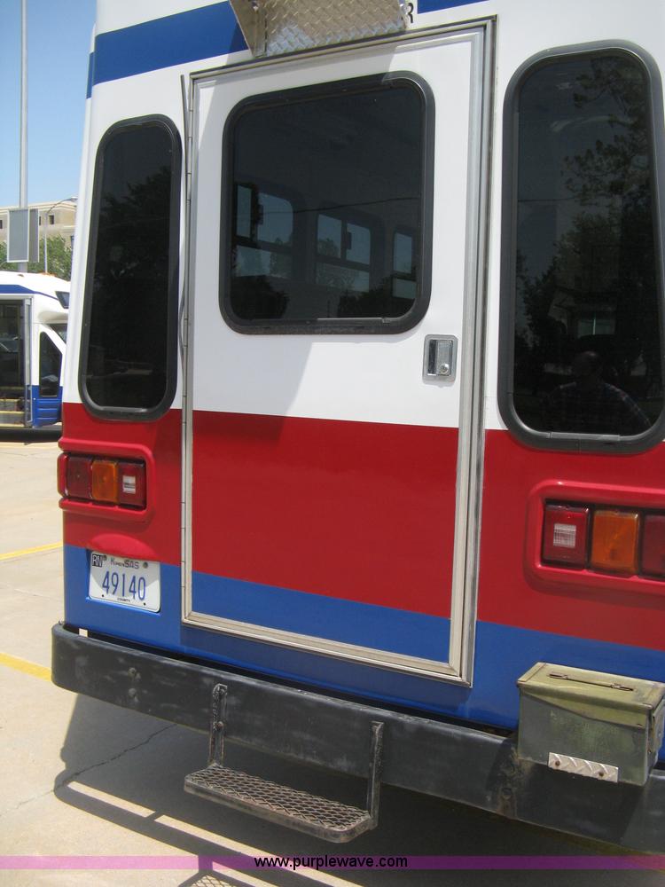 image for item D8365 1994 Ford E350 Collins transit bus