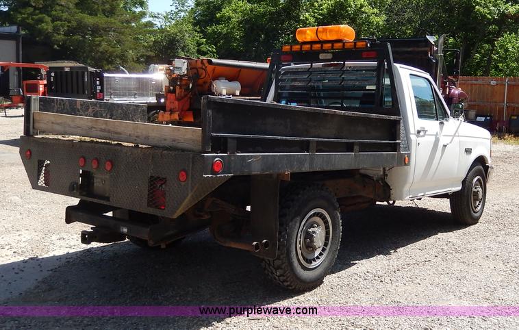 image for item H3049 1994 Ford F250 XL flatbed pickup truck