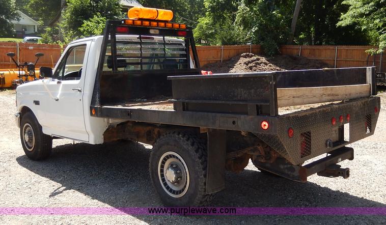 image for item H3049 1994 Ford F250 XL flatbed pickup truck
