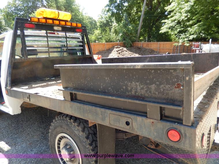 image for item H3049 1994 Ford F250 XL flatbed pickup truck