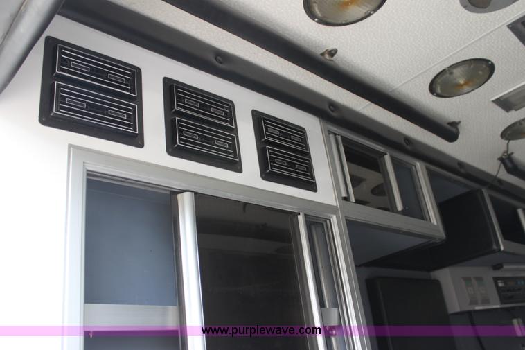 image for item H7456 1996 Freightliner FL60 emergency vehicle