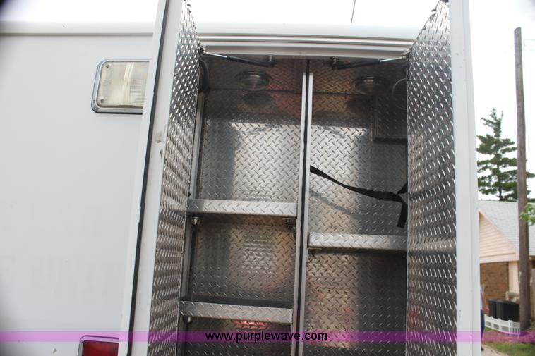 image for item H7456 1996 Freightliner FL60 emergency vehicle