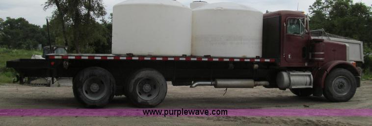 image for item E3997 1987 Peterbilt 357 flatbed truck