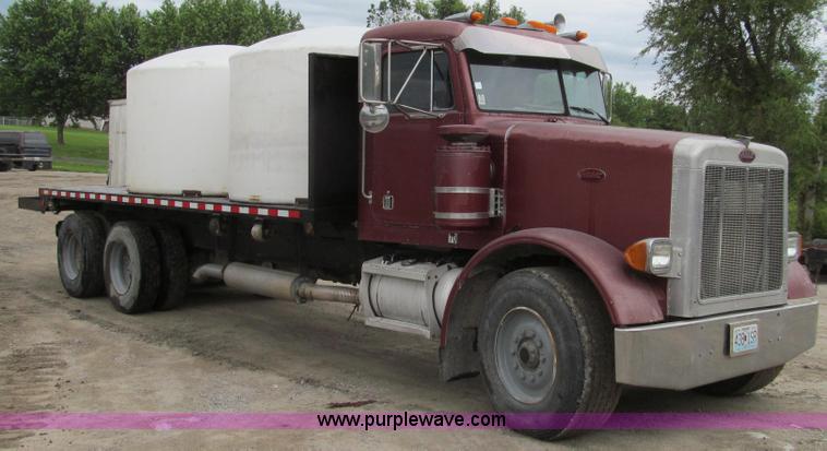 image for item E3997 1987 Peterbilt 357 flatbed truck