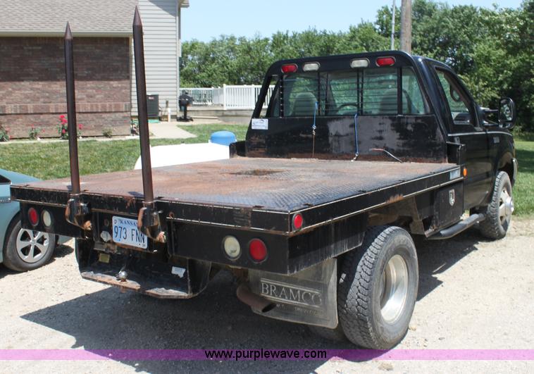image for item H7476 1999 Ford F350 XLT flatbed truck