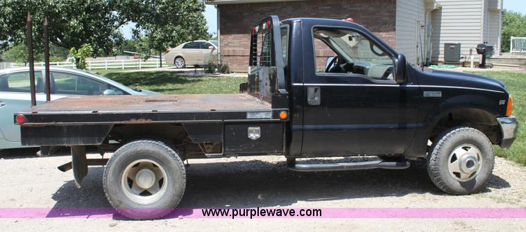 image for item H7476 1999 Ford F350 XLT flatbed truck