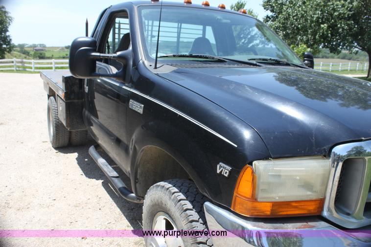 image for item H7476 1999 Ford F350 XLT flatbed truck