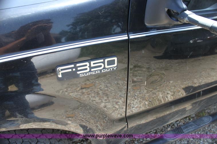 image for item H7476 1999 Ford F350 XLT flatbed truck