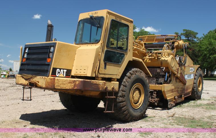 image for item H7464 2000 Caterpillar 615C Series II paddle scraper