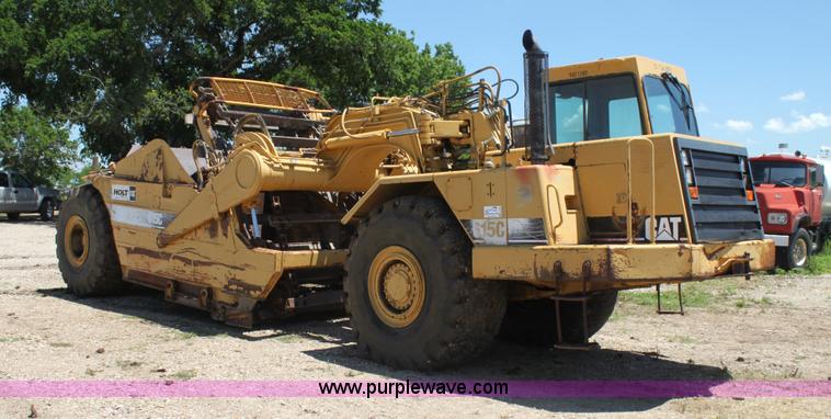 image for item H7464 2000 Caterpillar 615C Series II paddle scraper