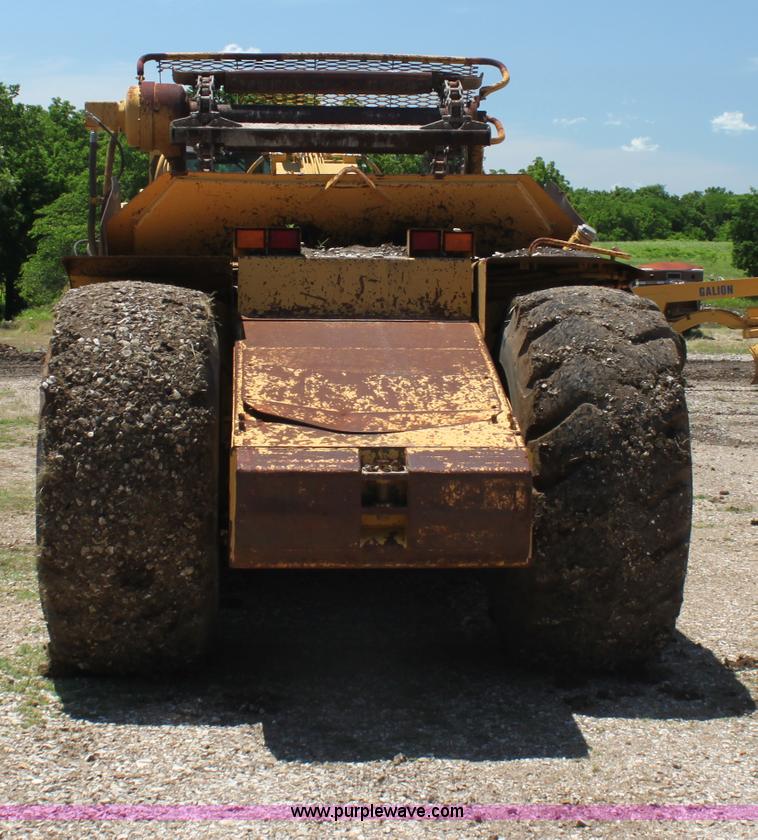 image for item H7464 2000 Caterpillar 615C Series II paddle scraper