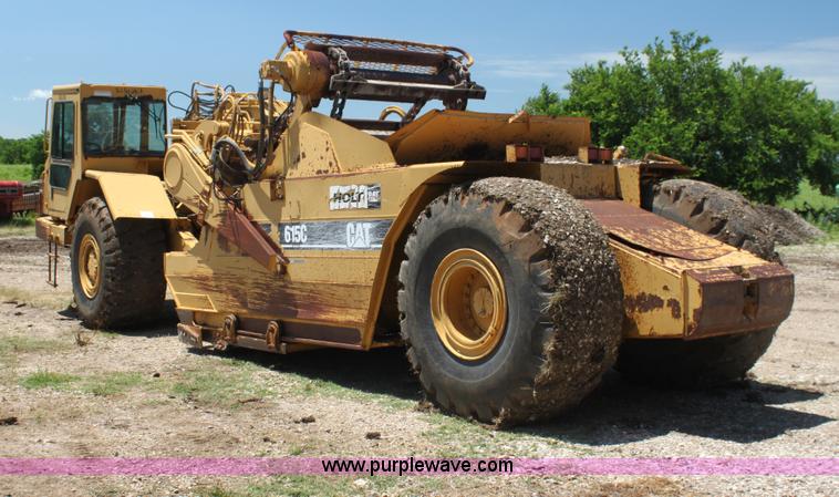 image for item H7464 2000 Caterpillar 615C Series II paddle scraper