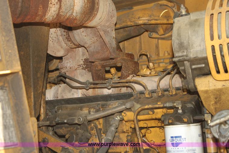 image for item H7464 2000 Caterpillar 615C Series II paddle scraper