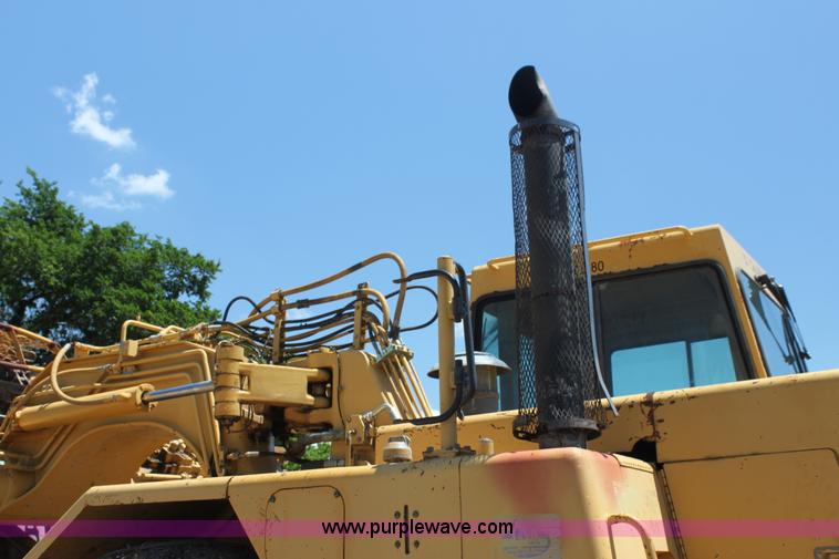 image for item H7464 2000 Caterpillar 615C Series II paddle scraper