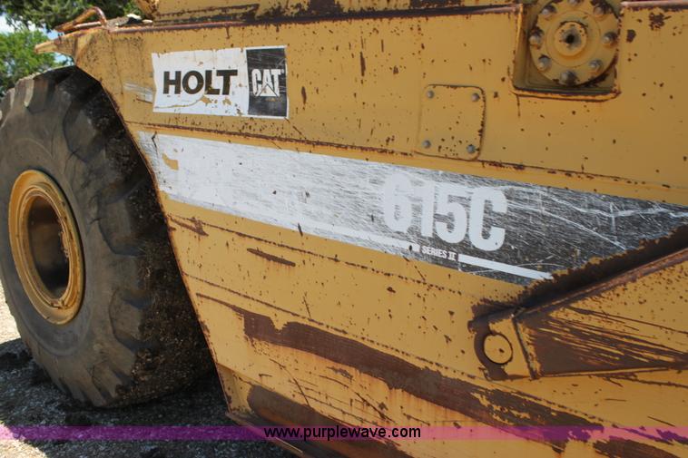 image for item H7464 2000 Caterpillar 615C Series II paddle scraper