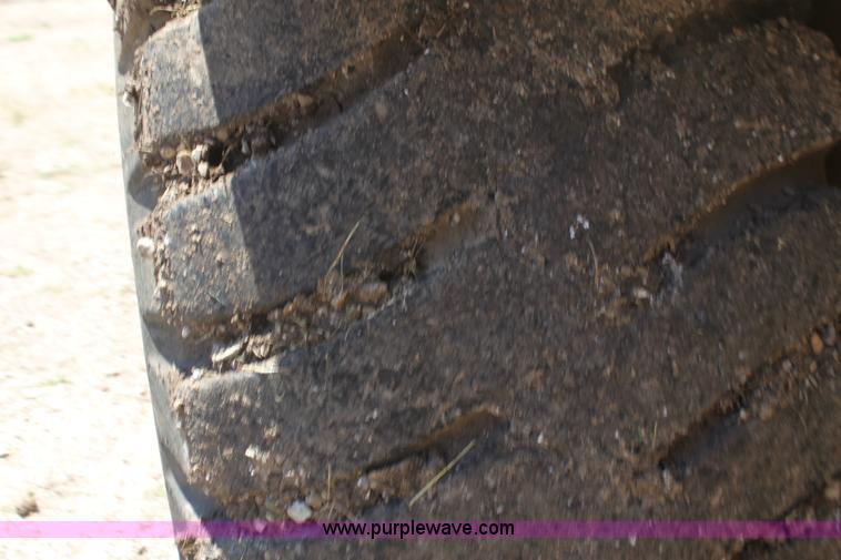 image for item H7464 2000 Caterpillar 615C Series II paddle scraper