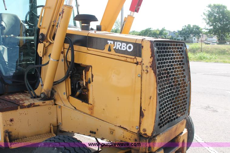 image for item I7989 1999 John Deere 310SE backhoe