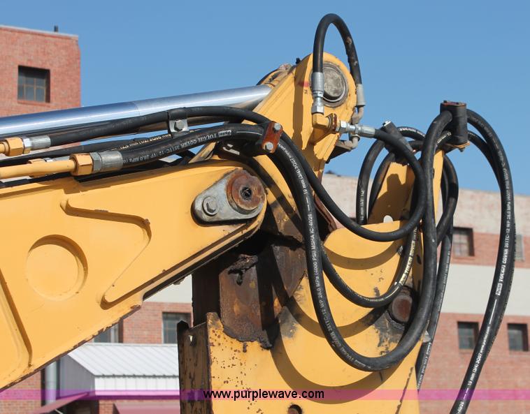 image for item I7989 1999 John Deere 310SE backhoe