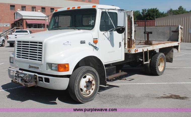 image for item I7994 1998 International 4700 low profile dump bed semi truck