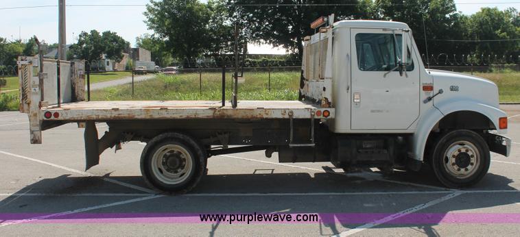 image for item I7994 1998 International 4700 low profile dump bed semi truck