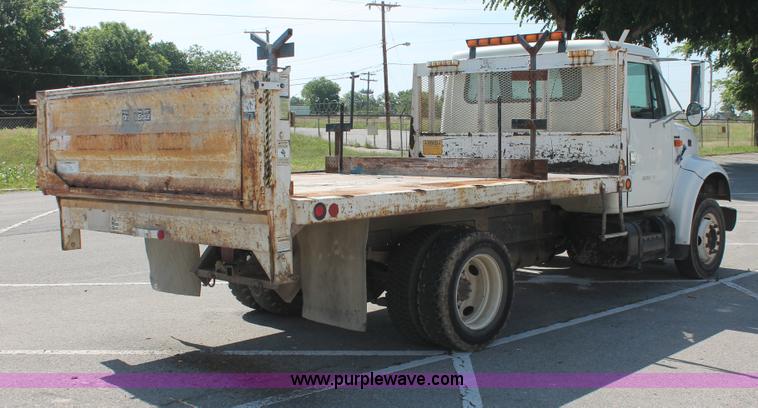 image for item I7994 1998 International 4700 low profile dump bed semi truck