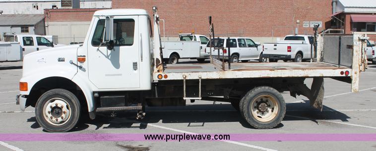image for item I7994 1998 International 4700 low profile dump bed semi truck
