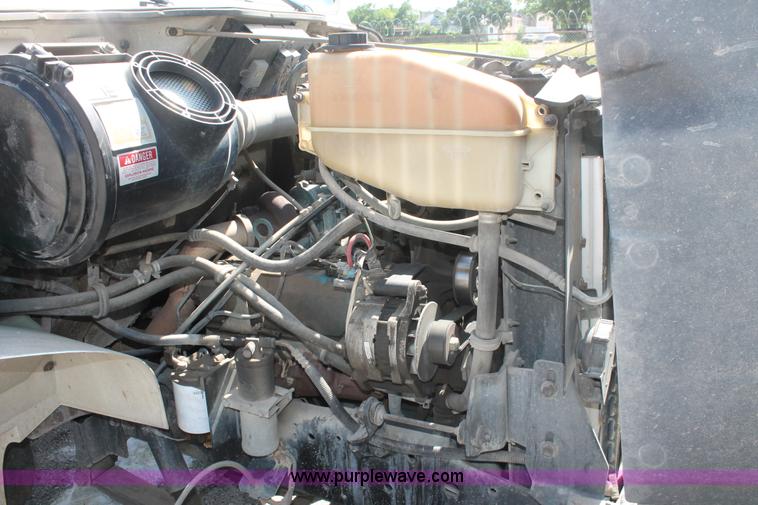 image for item I7994 1998 International 4700 low profile dump bed semi truck