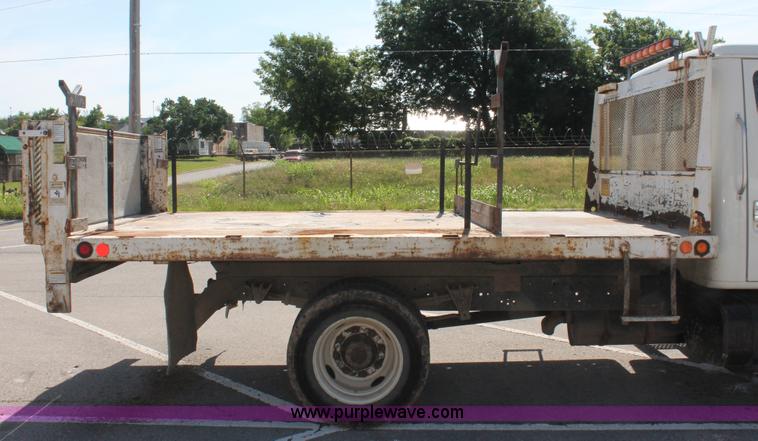image for item I7994 1998 International 4700 low profile dump bed semi truck