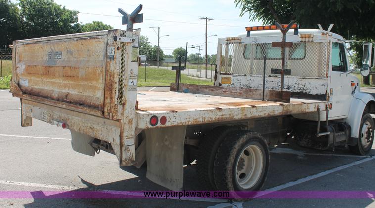 image for item I7994 1998 International 4700 low profile dump bed semi truck