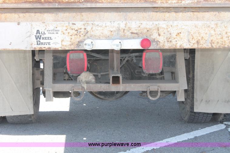 image for item I7994 1998 International 4700 low profile dump bed semi truck