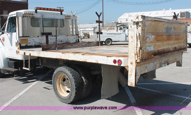 image for item I7994 1998 International 4700 low profile dump bed semi truck